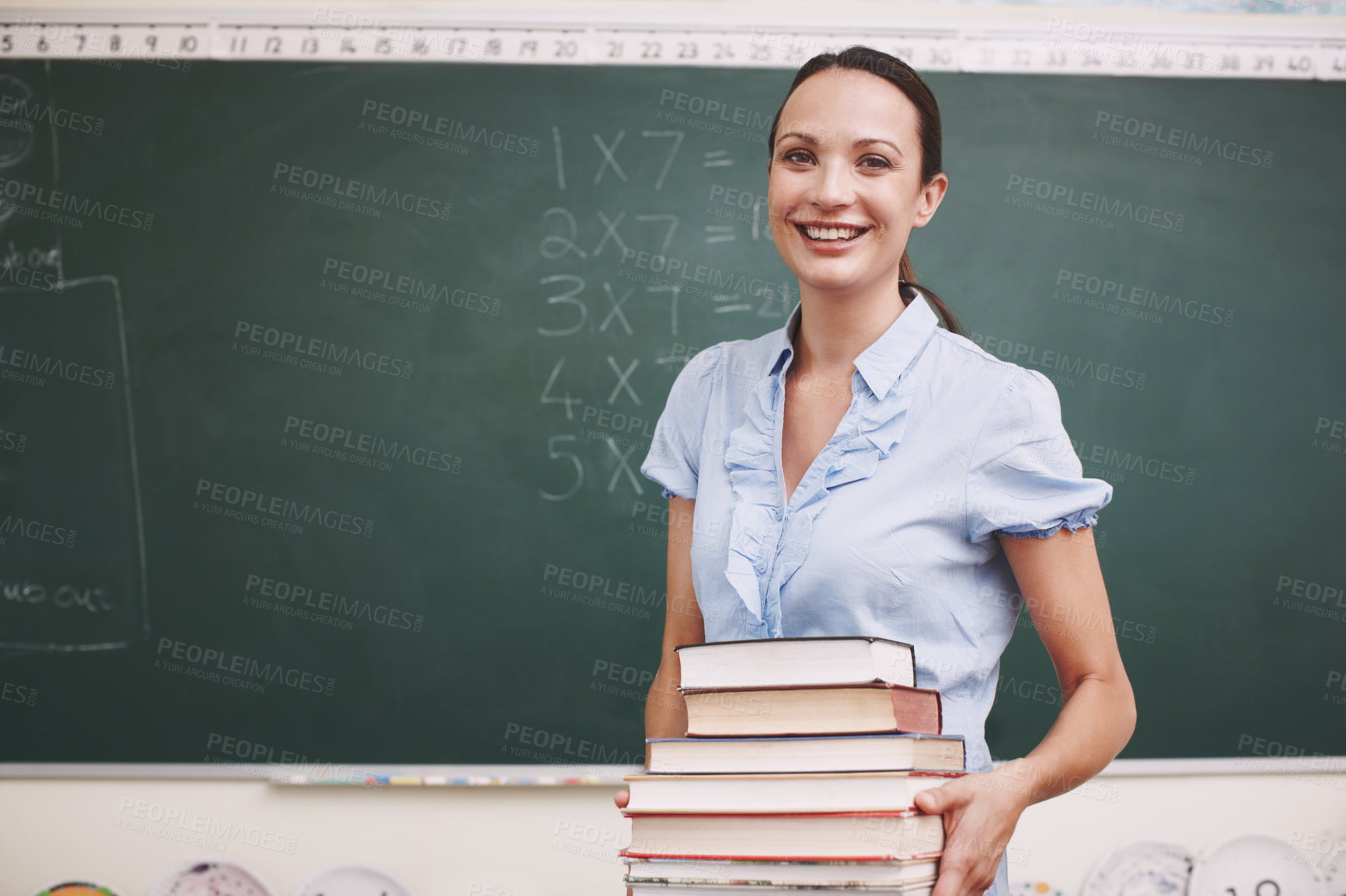 Buy stock photo Math class, happy teacher and books for knowledge, learning and problem solving for development. Woman, portrait and classroom for solution, confidence or smile with chalkboard for school education