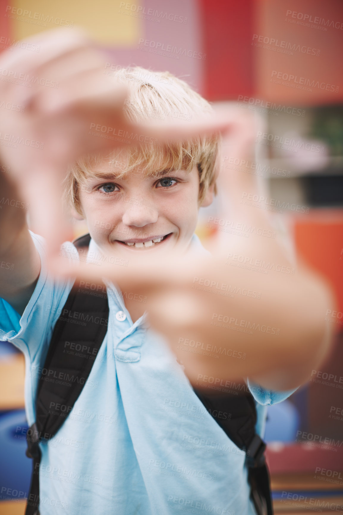 Buy stock photo Finger, frame and boy student with portrait in classroom for creative imagination, education perspective and happy. Learner, person and hand emoji at elementary school for learning, shape and symbol