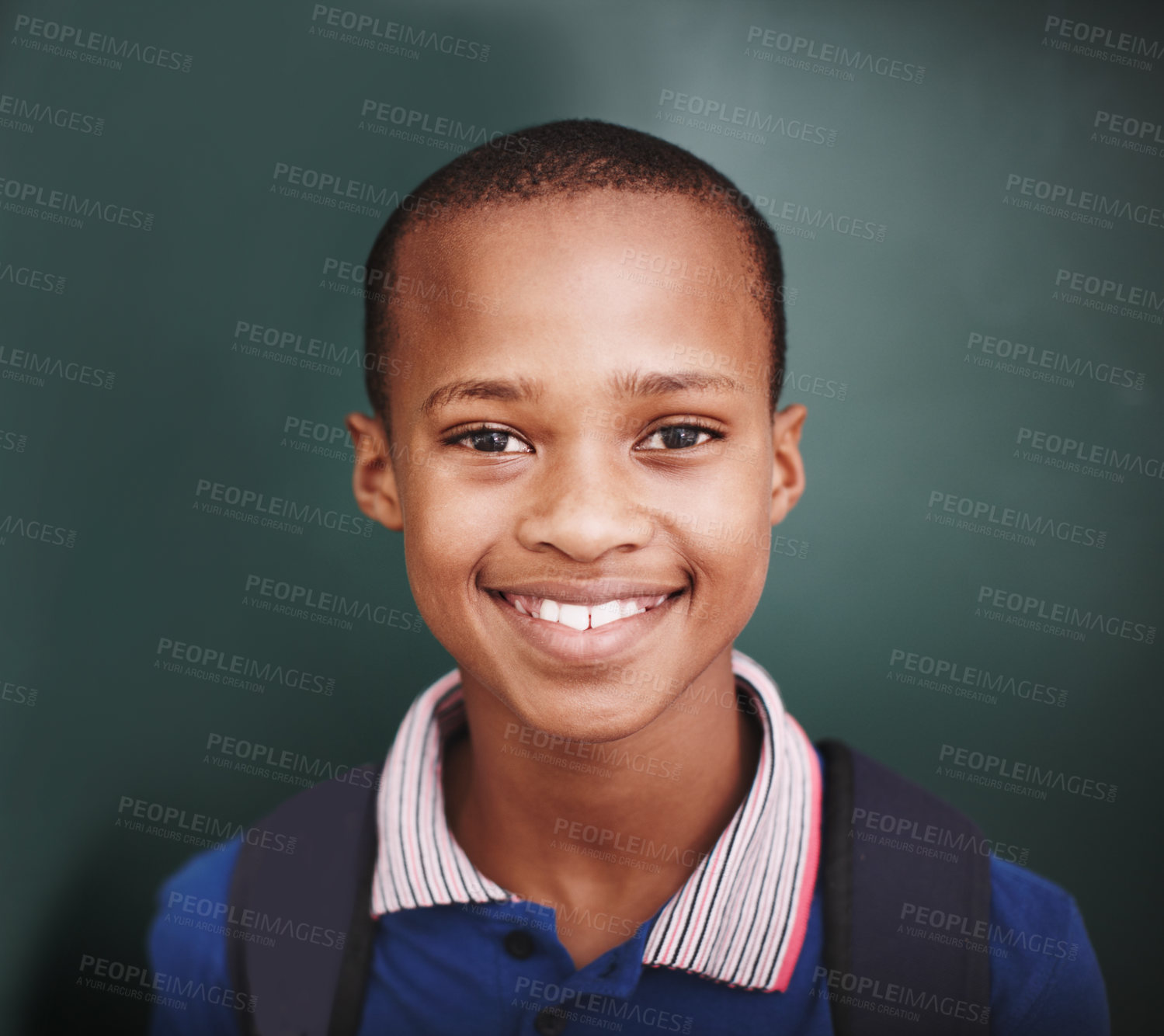Buy stock photo Head and shoulders portrait of a happy african american student standing at the blackboard
