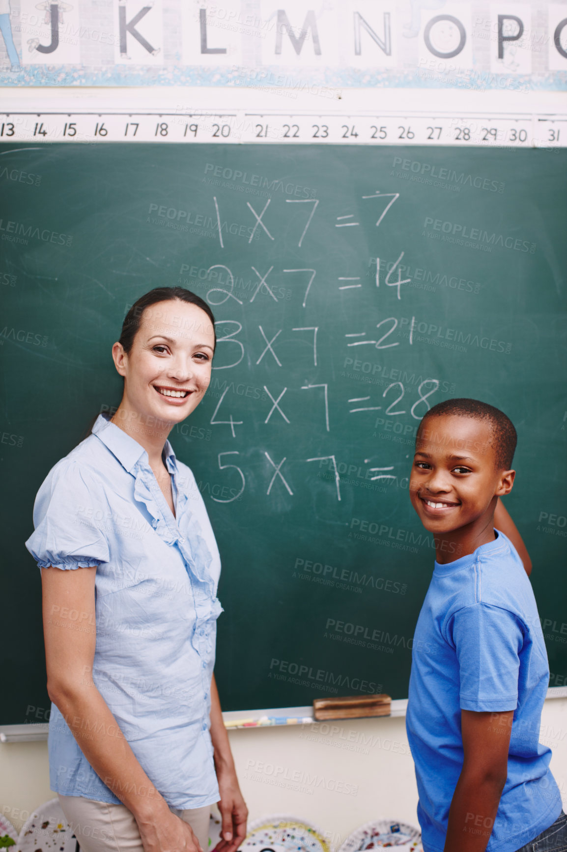 Buy stock photo Math, teacher and boy portrait at chalkboard in classroom for solving number problem or answer question. Lesson, student and writing solution for multiplication at school with scholarship or learning