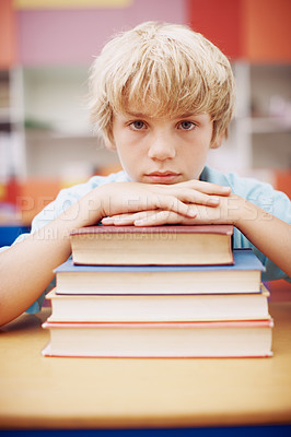 Buy stock photo Books, education and portrait of child student in classroom of school for development, future or growth. Face, learning or study and bored kid at desk in class for lesson, reading or scholarship