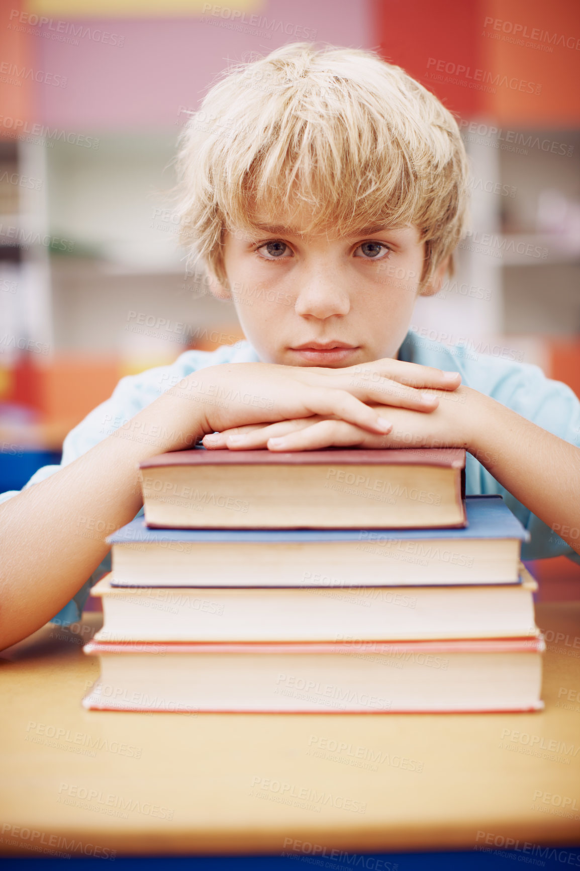 Buy stock photo Books, education and portrait of child student in classroom of school for development, future or growth. Face, learning or study and bored kid at desk in class for lesson, reading or scholarship