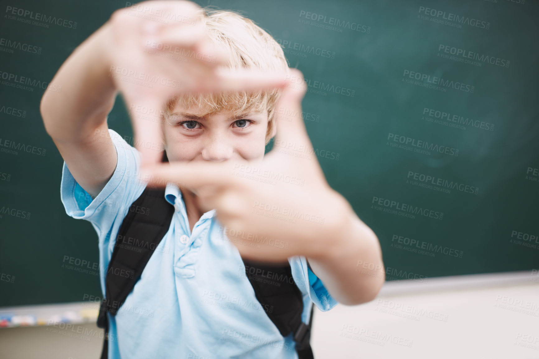 Buy stock photo Chalkboard, fingers frame and portrait of boy in classroom at school for development or education. Hand gesture, learning and study with happy student in class for future, growth or scholarship