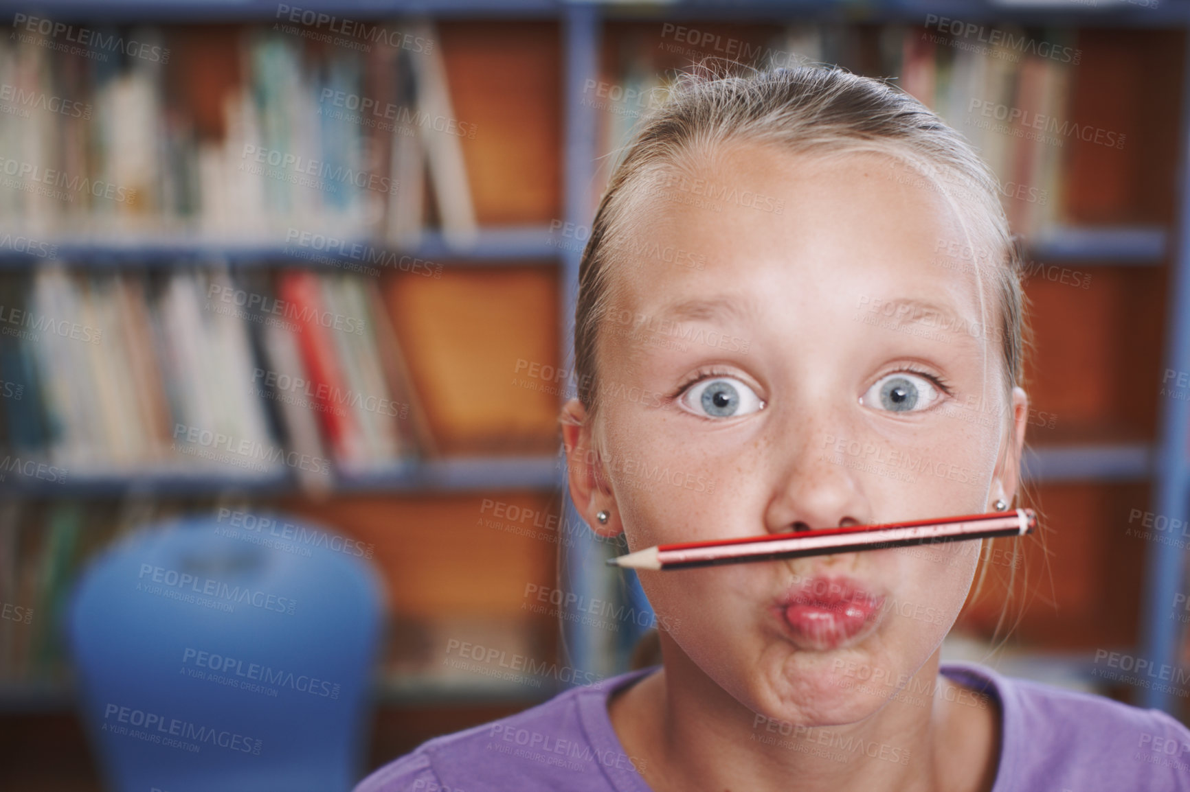 Buy stock photo Portrait, funny and girl student with pencil at school library on break for education or learning. Playful learner, goofy or silly kid with mouth or eyes wide open for joke or studying in Australia