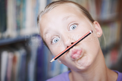 Buy stock photo Portrait, mouth and girl student with pencil at school library on break for education or learning. Playful learner, goofy or silly kid with games or eyes open for funny joke or studying in Australia