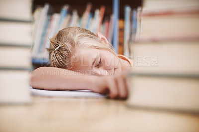Buy stock photo A cute young girl fast asleep while surrounded by books at the library