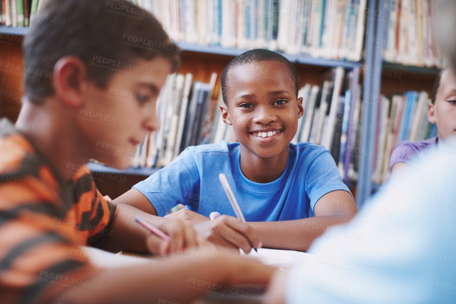 Buy stock photo Black boy, writing and learning with books in library for assessment research, education notes and studying. Kids, student and notebook with school test, language development and reading exam of work