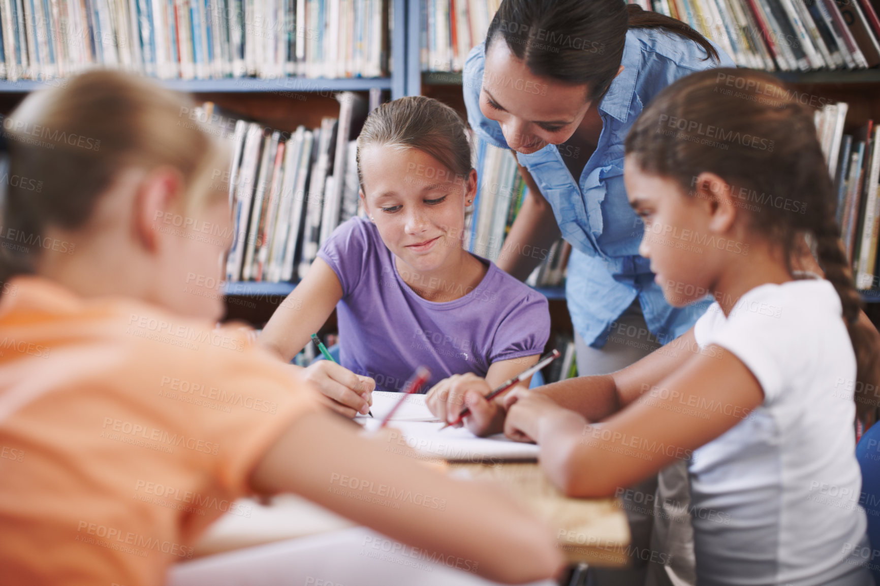 Buy stock photo Exam, teacher and student with questions in a classroom or library for learning development. Education, kids and children asking help from woman with smile and support for assignment at school