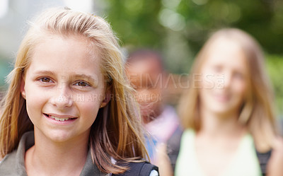 Buy stock photo person; Portrait of a cute primary school girl smiling at you with friends in the background