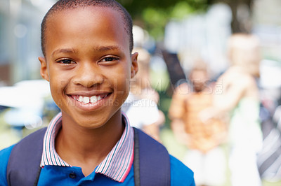 Buy stock photo Confident african-american boy smiling at you with schoolmates in the background - copyspace