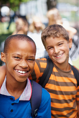 Buy stock photo Two school boys who are best friends posing for a picture outside - copyspace