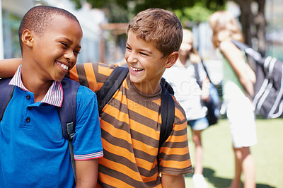 Buy stock photo Two boys in their school playground having a good laugh together - copyspace