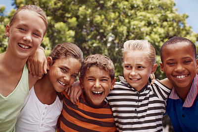 Buy stock photo A group of friends hugging each other while enjoying recess at school