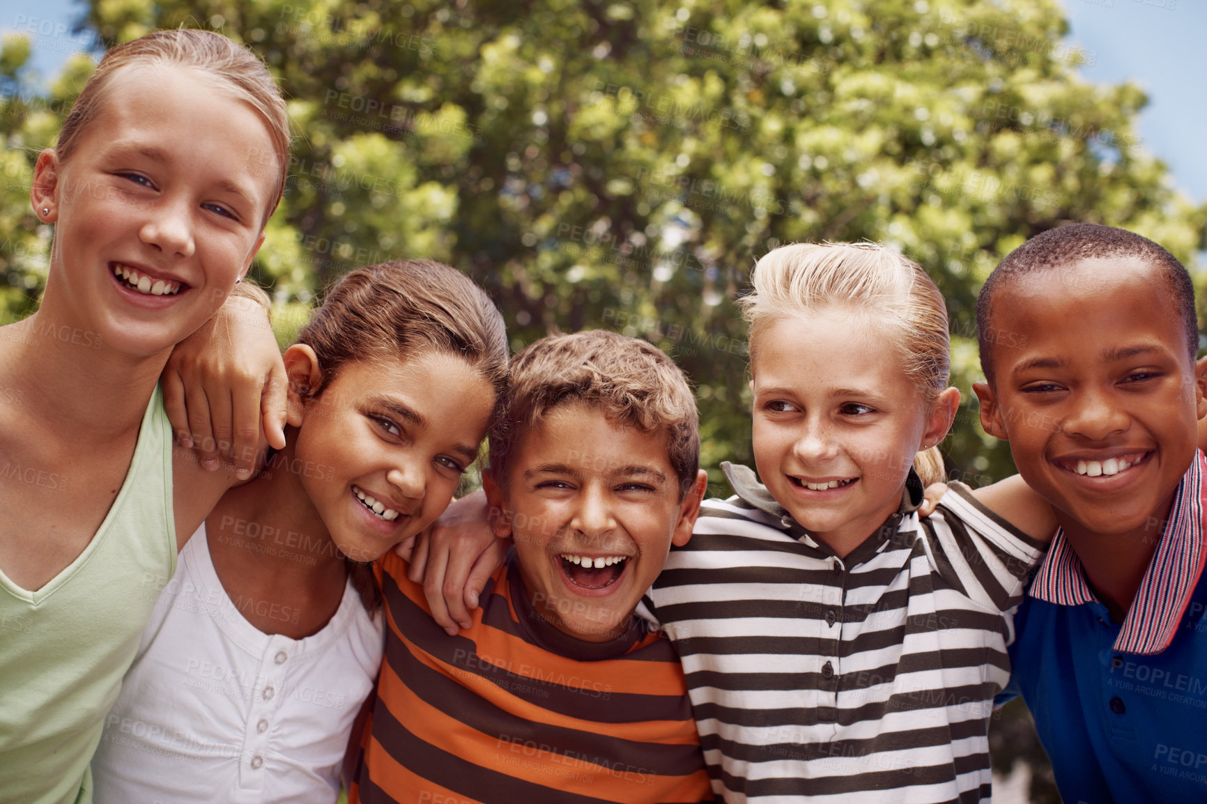 Buy stock photo Children, hugging and smile of student friends outdoor at school together for development. Diversity, scholarship or smile with boy and girl kids embracing on playground for learning or study