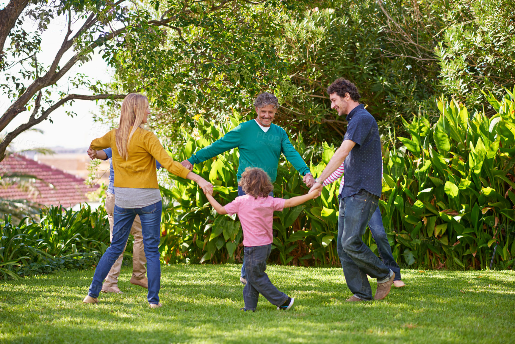 Buy stock photo Happy family, holding hands and children dance outdoor or play game in summer together in circle with grandparents. Ring a rosy, smile and kids in garden on holiday, vacation and bonding with parents