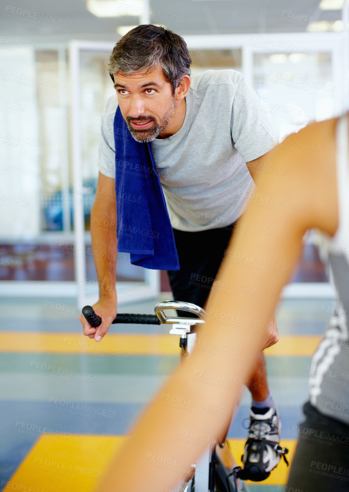 Buy stock photo Mature, spinning class and man in training, bike and exercise for wellness, health and fitness in gym. Athlete, active or bicycle for cardio, strong legs or power for body workout, sports or cycling