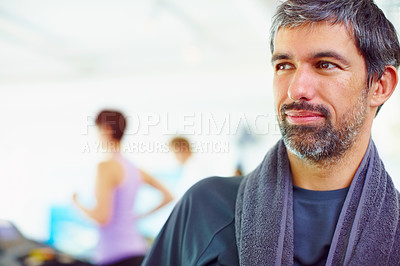 Buy stock photo Closeup of smart thoughtful man in a gym looking away with people in background