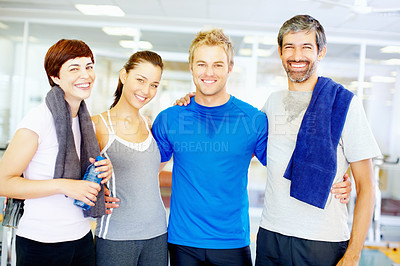 Buy stock photo Happy men and women standing together in indoor gym