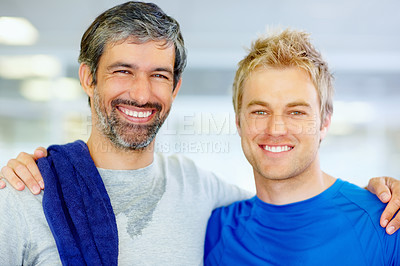 Buy stock photo Portrait of two male friends with arms around at fitness center