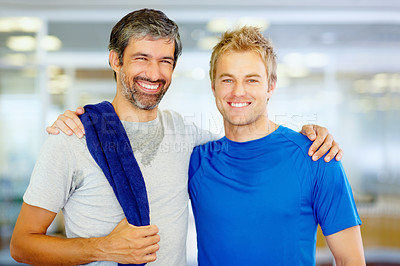 Buy stock photo Portrait of two male friends with arms around at health club