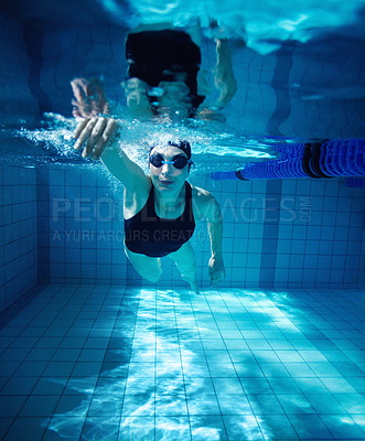 Buy stock photo Portrait of a young female swimmer competing in a swimming pool