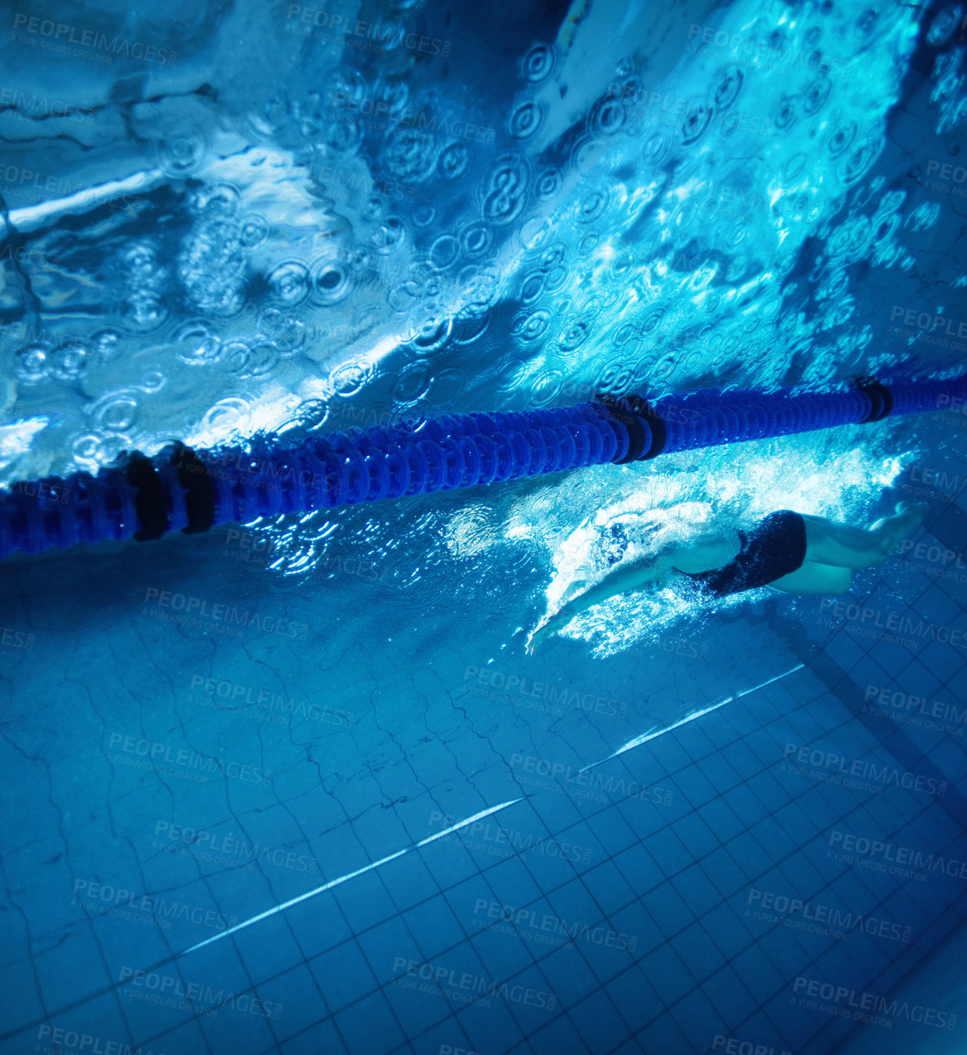 Buy stock photo Underwater, exercise and person in swimming pool, fitness and training for competition, cardio and athlete. Lines, clean and aquatic sports, recreational and liquid for race, rope and arena for games