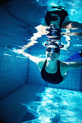 Buy stock photo Portrait of a young female swimmer swimming breaststroke 