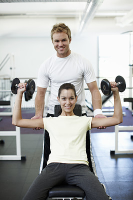 Buy stock photo Fitness, weights and portrait of personal trainer with woman in gym for lifting with muscle strength. Exercise, happy and coach with athlete for bodybuilding workout with equipment in sports center.