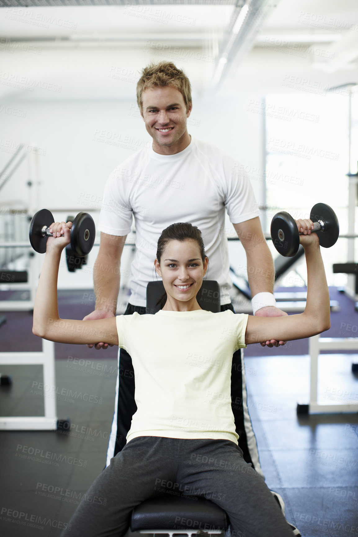 Buy stock photo Fitness, weights and portrait of personal trainer with woman in gym for lifting with muscle strength. Exercise, happy and coach with athlete for bodybuilding workout with equipment in sports center.