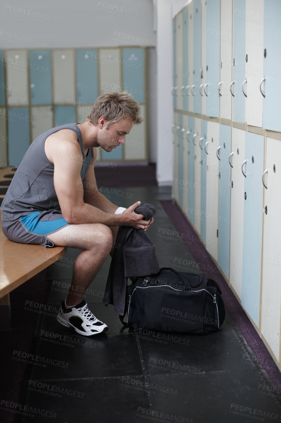 Buy stock photo Crppped shot of a young man in the gym after a solid workout