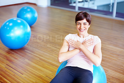 Buy stock photo Portrait of happy woman doing sit ups on pilates ball
