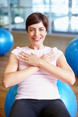 Buy stock photo Portrait of fit woman smiling while working out on pilates ball