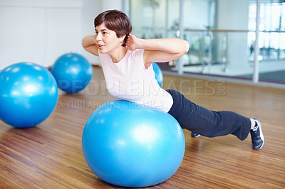 Buy stock photo Woman doing fitness exercise using pilates ball