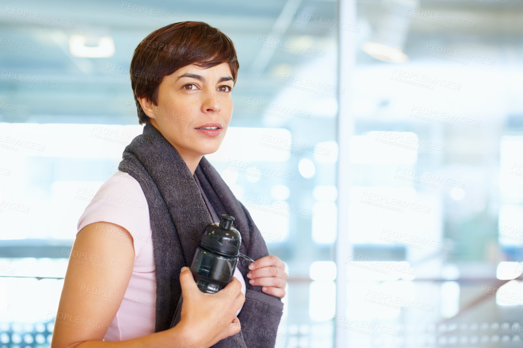 Buy stock photo Woman, thinking and gym with water bottle on break, fitness and sweaty towel for recovery. Female person, contemplating workout progress and mineral liquid for nutrition, rest and tired athlete