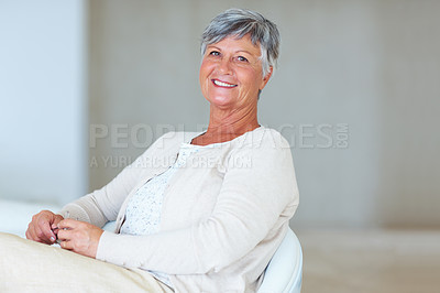 Buy stock photo Senior woman, portrait and relax on chair in home, morning peace and smile for comfort in living room. Female person, elderly and confidence in retirement, happy and cozy couch with pride on weekend