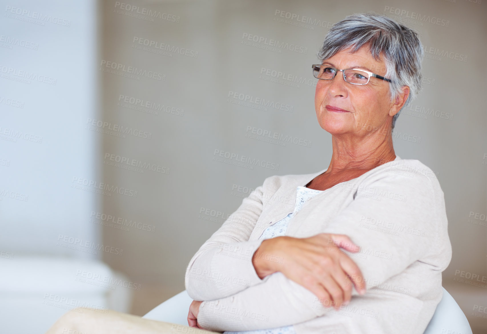 Buy stock photo Senior woman, thinking and arms crossed in home, morning reflection and smile for memory on chair. Female person, elderly and confidence in retirement, happy and cozy couch for nostalgia on weekend