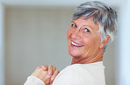 Smiling mature woman with clasped hands