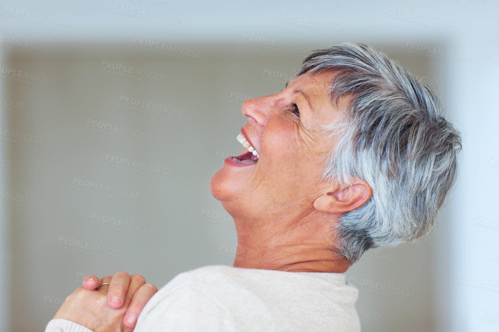 Buy stock photo Senior woman, laughing and relax in home, morning happiness and smile for comfort in living room. Female person, elderly and confidence in retirement, profile and apartment with funny joke or humor