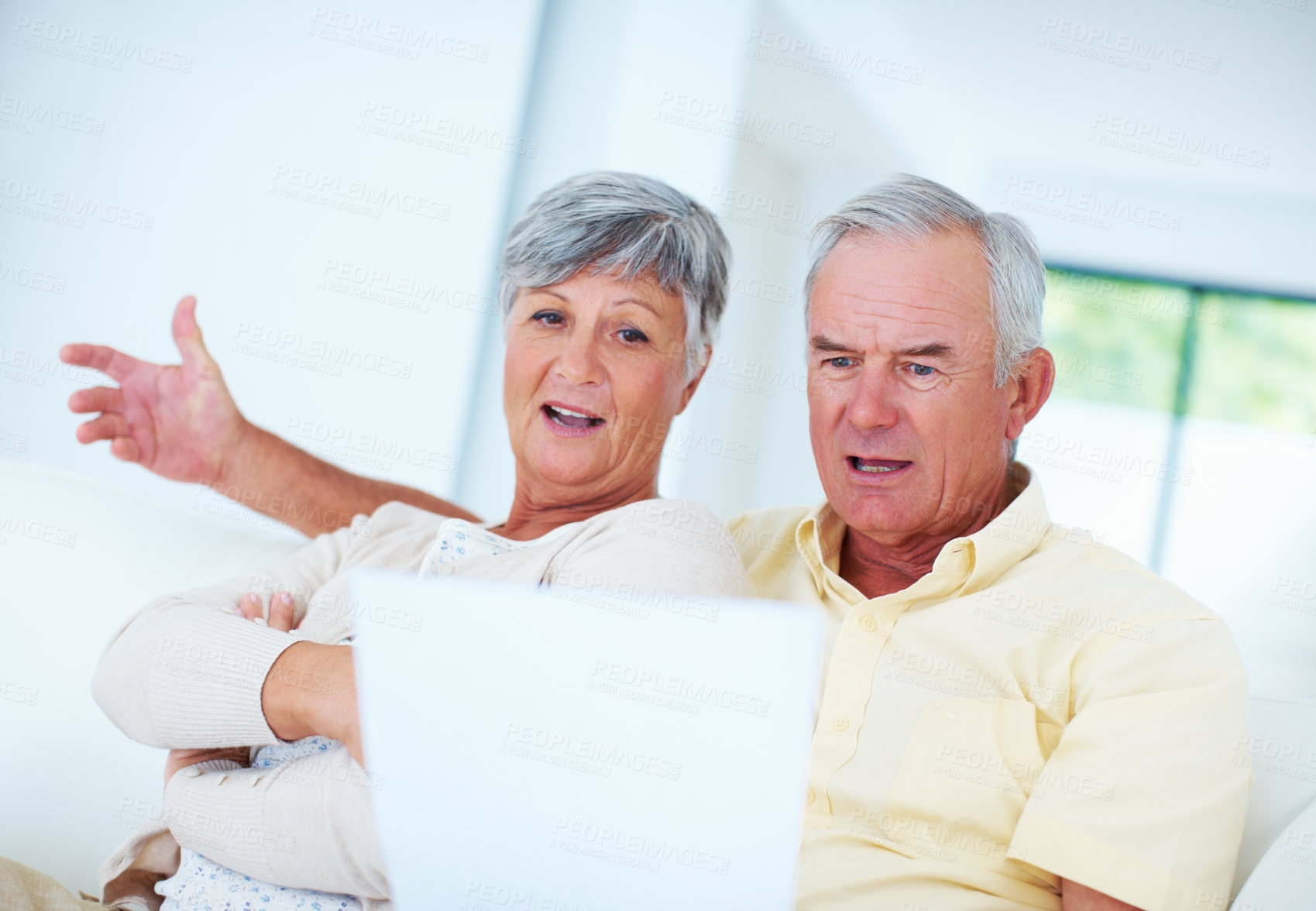 Buy stock photo Mature couple, documents and finance with bills for payment, mortgage or over budget on sofa at home. Elderly, man and woman with paperwork for financial expenses. invoice or pension fund at house