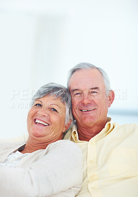 Buy stock photo Elderly couple, portrait and hug in home, security and love in marriage connection on couch. Senior people, embrace and commitment to relationship in retirement, bonding and support for comfort