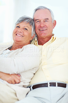 Buy stock photo Senior couple, portrait and safety in home, hug and love in marriage connection on couch. Elderly people, embrace and commitment to relationship in retirement, bonding and support for comfort on sofa