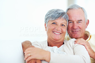 Buy stock photo Elderly couple, happy and portrait in home for relax, bonding and love with support, care and romance. Senior people, smile and connection in house for weekend break, marriage and embrace with trust