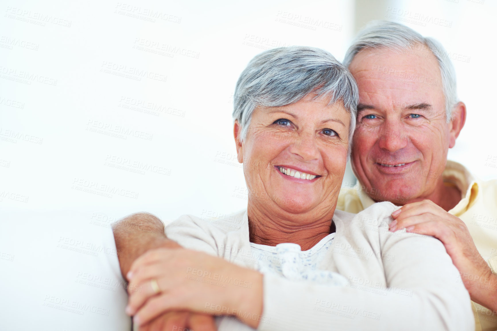 Buy stock photo Elderly couple, happy and portrait in home for relax, bonding and love with support, care and romance. Senior people, smile and connection in house for weekend break, marriage and embrace with trust