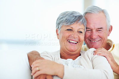 Buy stock photo Portrait of smiling mature couple spending time together at home