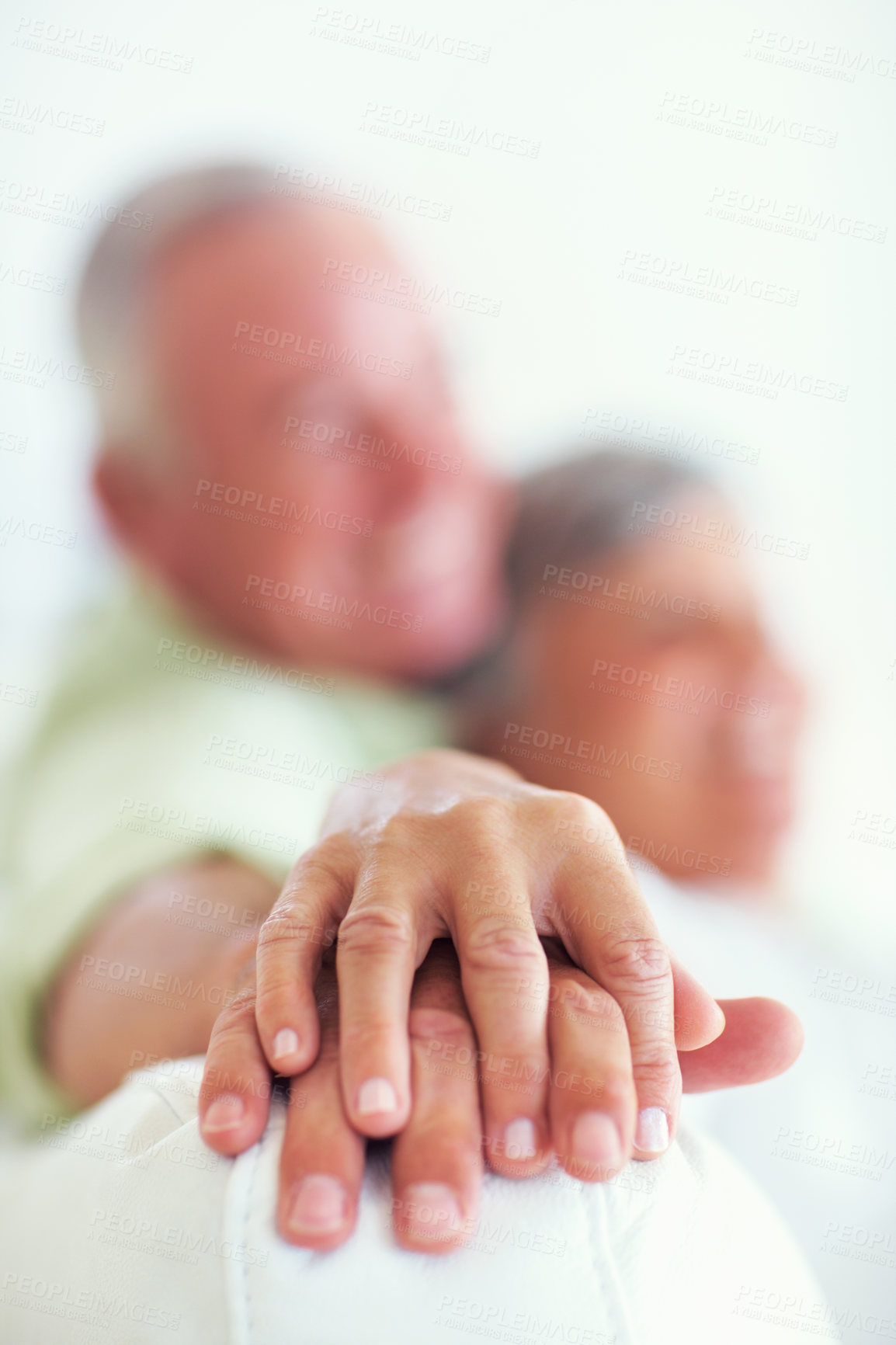 Buy stock photo Senior couple, sofa and holding hands for love, relax and bonding in house with closeup, care and support. Man, woman and romance in living room for relationship, marriage and commitment with comfort