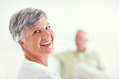 Buy stock photo Portrait of happy mature woman having happy time with man in background