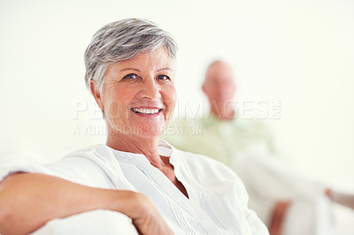 Buy stock photo Elderly woman, face and smile for retirement, confident and relax on weekend in home with good health. Senior person, portrait and happy for comfort, peace and break in living room with positive mood