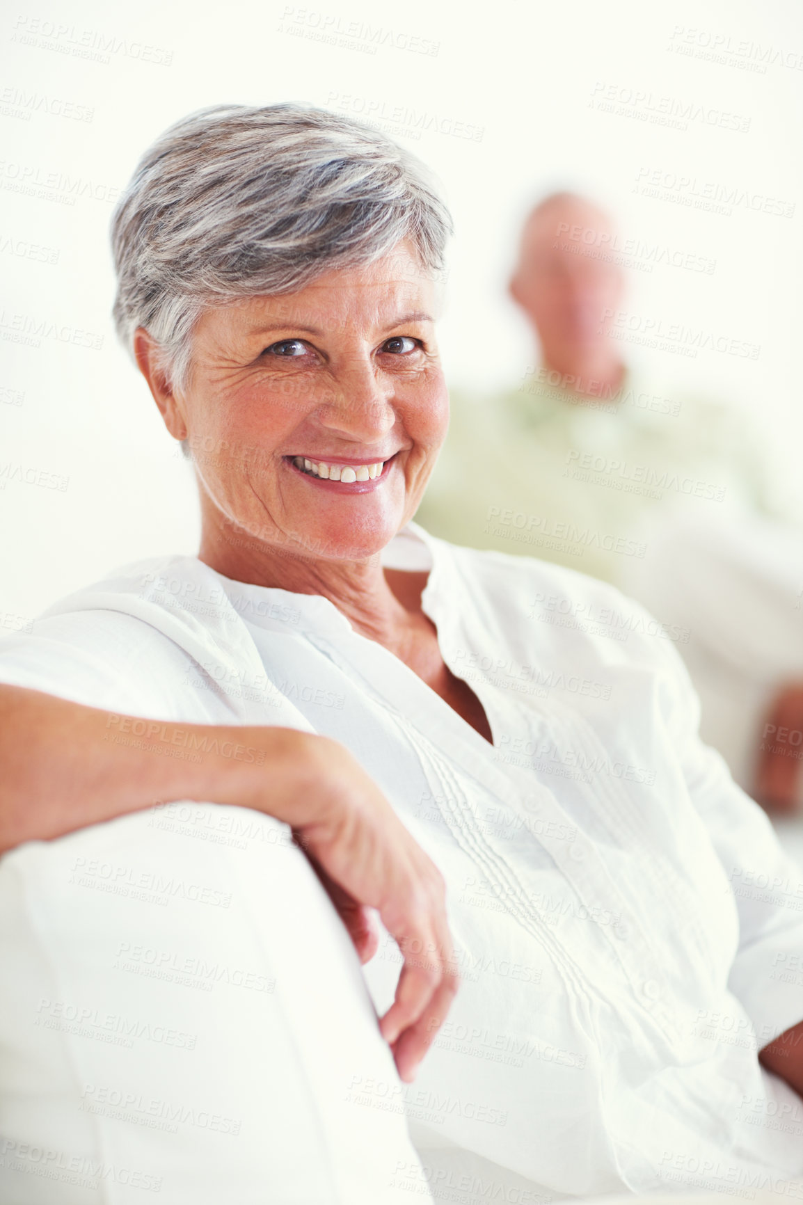 Buy stock photo Elderly woman, sofa and smile for retirement, confident and relax on weekend in home with good health. Senior person, portrait and happy for comfort, peace or break in living room with positive mood 