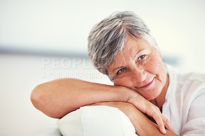 Buy stock photo Closeup of lovely mature woman smiling while relaxing at home