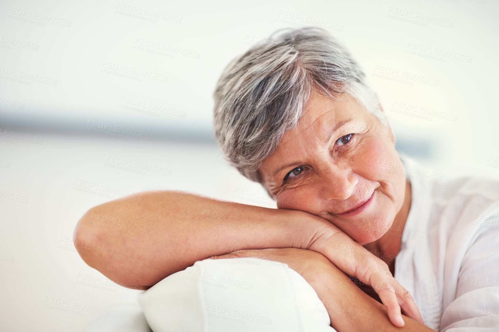 Buy stock photo Thinking, relax and senior woman at home for memory, resting and enjoy in retirement on sofa. Mockup space, female person and confident with smile in living room, happy and positive attitude on couch